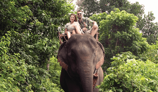 People riding on an elephant.