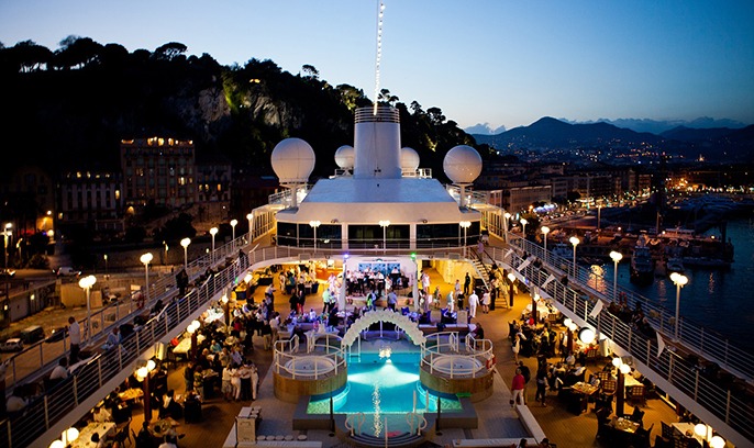Night view of the top deck of a cruise ship.